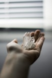 person holding crystal stones