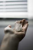 person holding crystal stones
