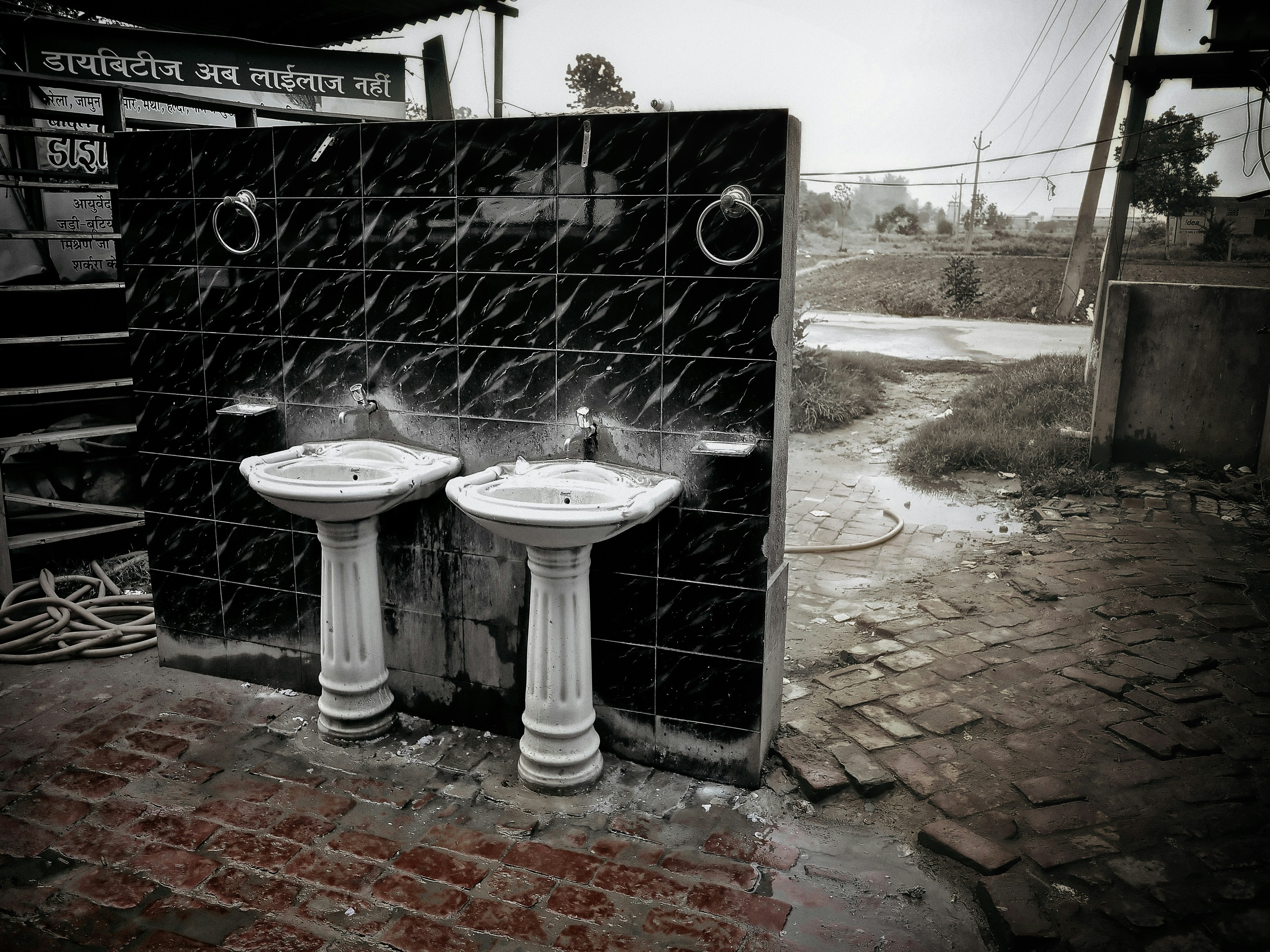 Two bathroom sinks outside.