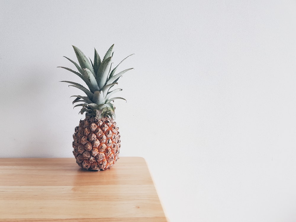 pineapple on beige wooden furniture