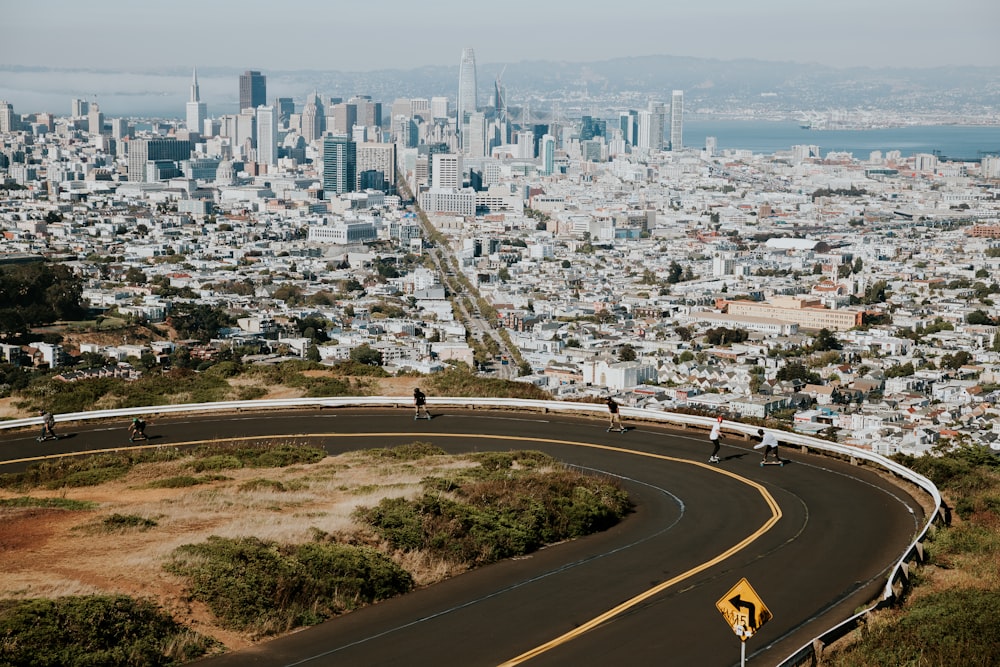 photo of people boarding down road