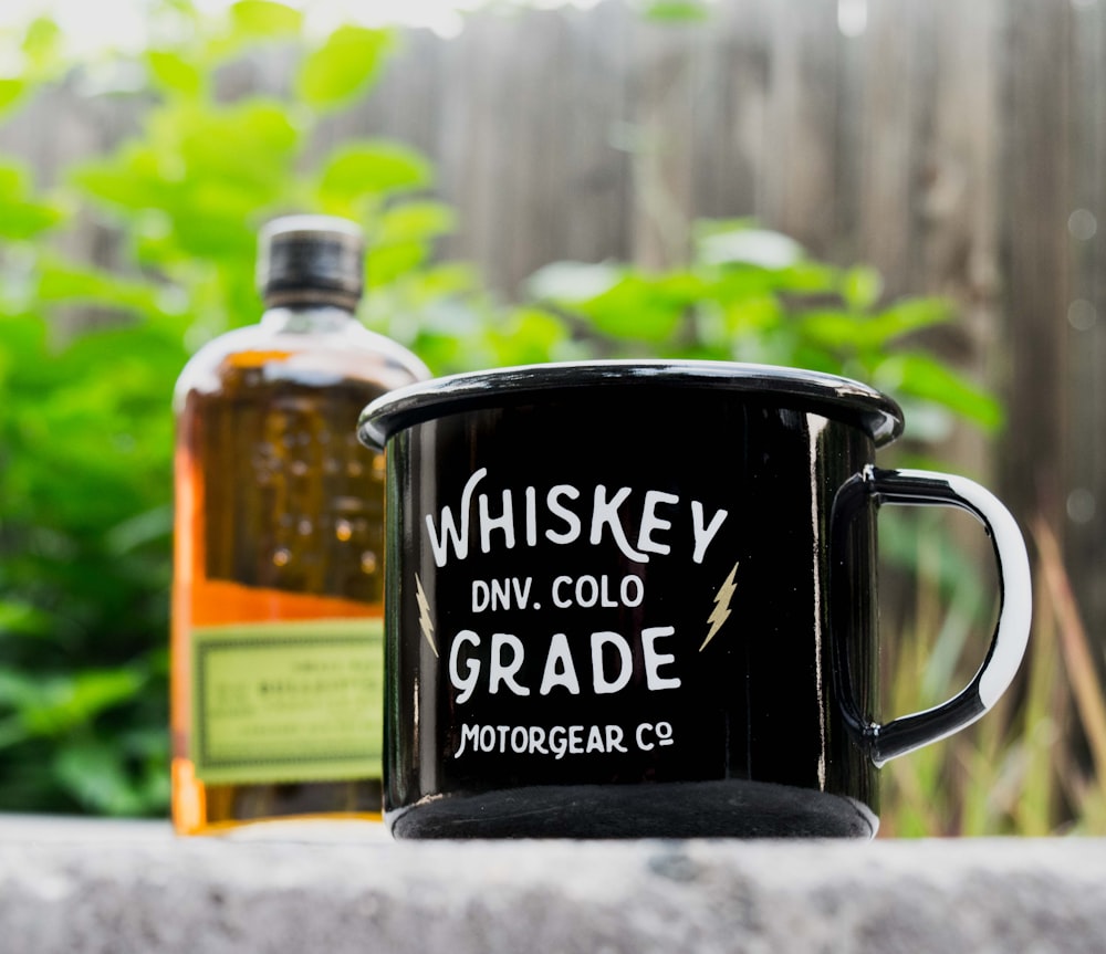 close-up photo of black and white Whiskey DNV. Cold Grade Motor Gear Co. mug