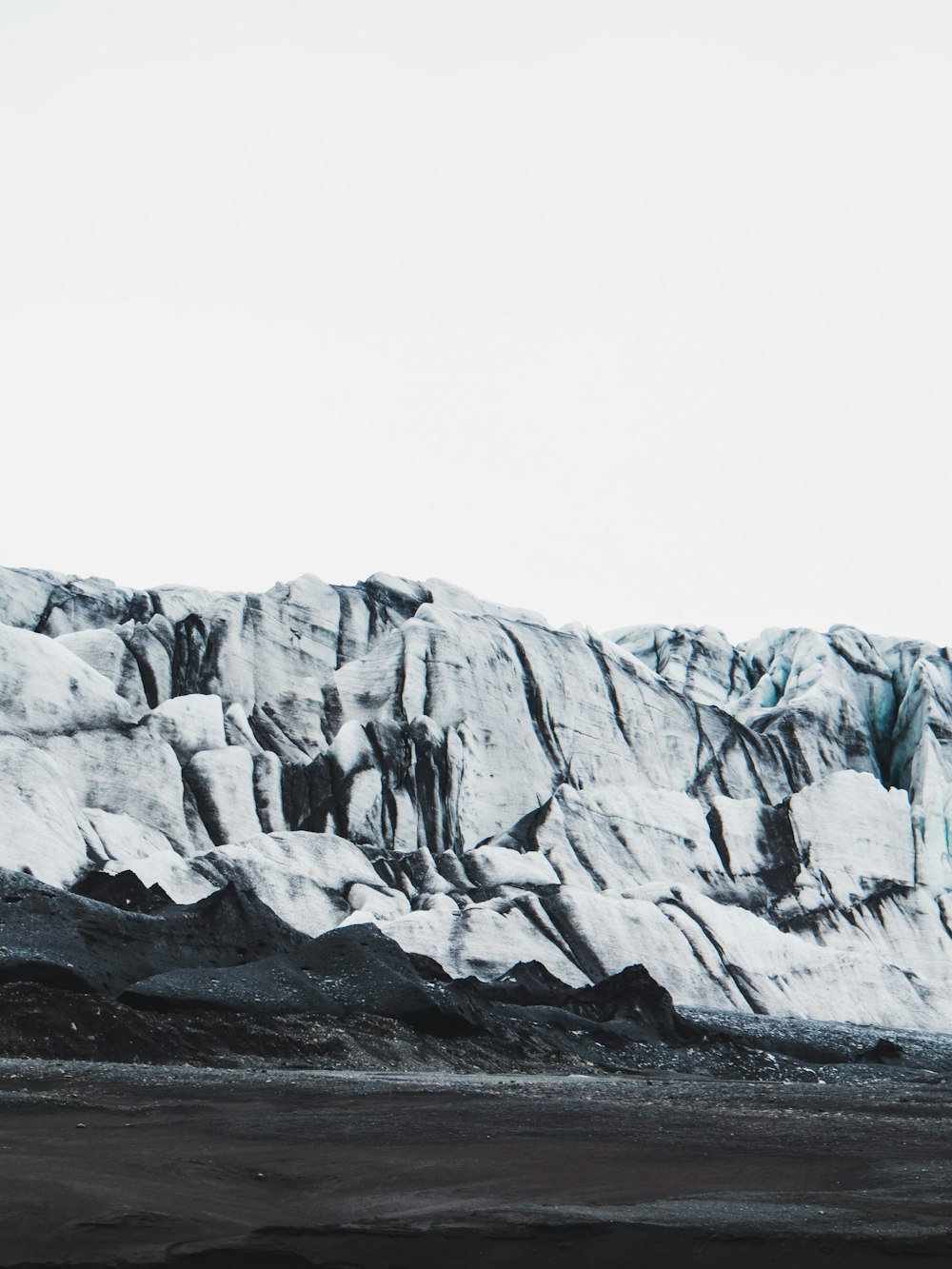 black sand near mountain during winter