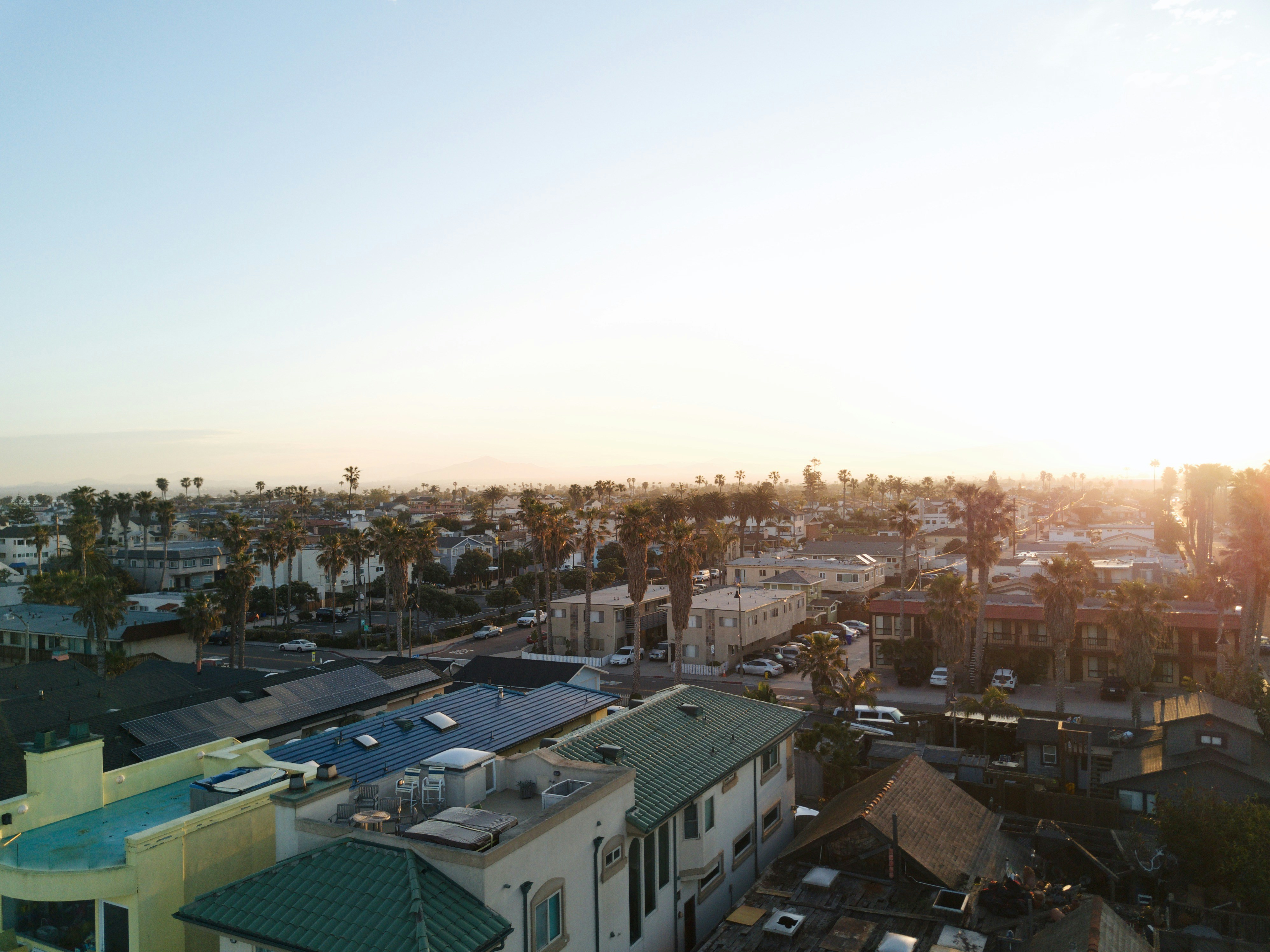 aerial view of city buildings during daytime, A drone shot of the most southern beach in California. The picture doesn’t do it justice but gives you an idea. Some of the most gorgeous sunrises I have witnessed have been right here.