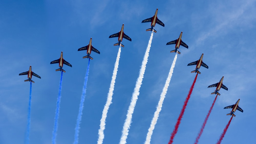 low angle photo of jetplane contrail airshow