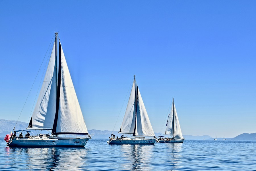 Three sailboats daytime