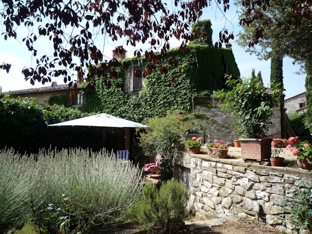 Peaceful garden corner at Eleonora Holiday Home with blooming flowers and cozy seating.