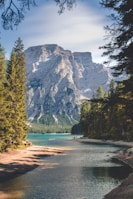white mountain near body of water