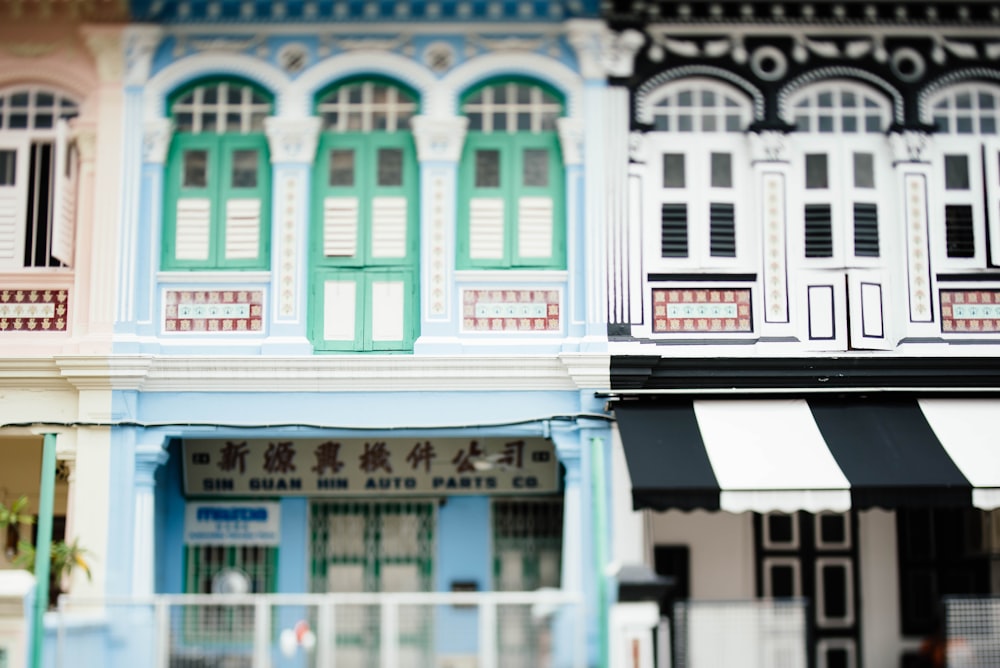 white and black painted house at daytime