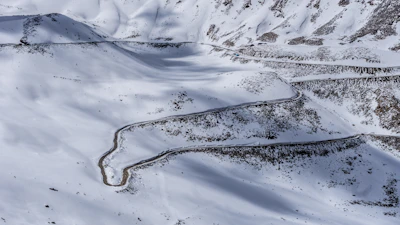 Winding road snaking through the snow-dusted Tizi n’Tichka pass.
