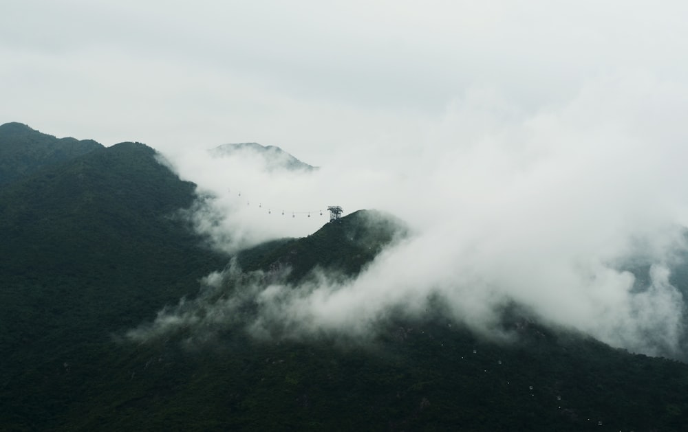 white clouds above brown mountains landscape photography