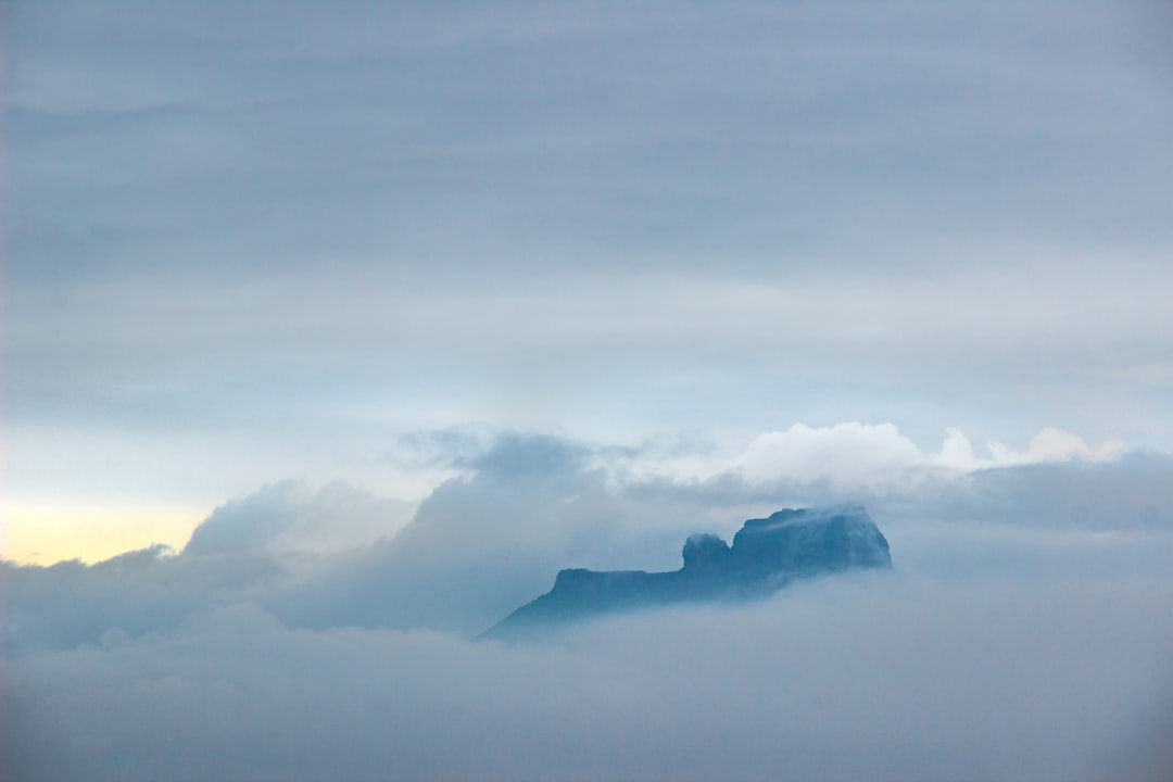 gray plateau with sea of clouds