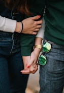 man and woman holding hands