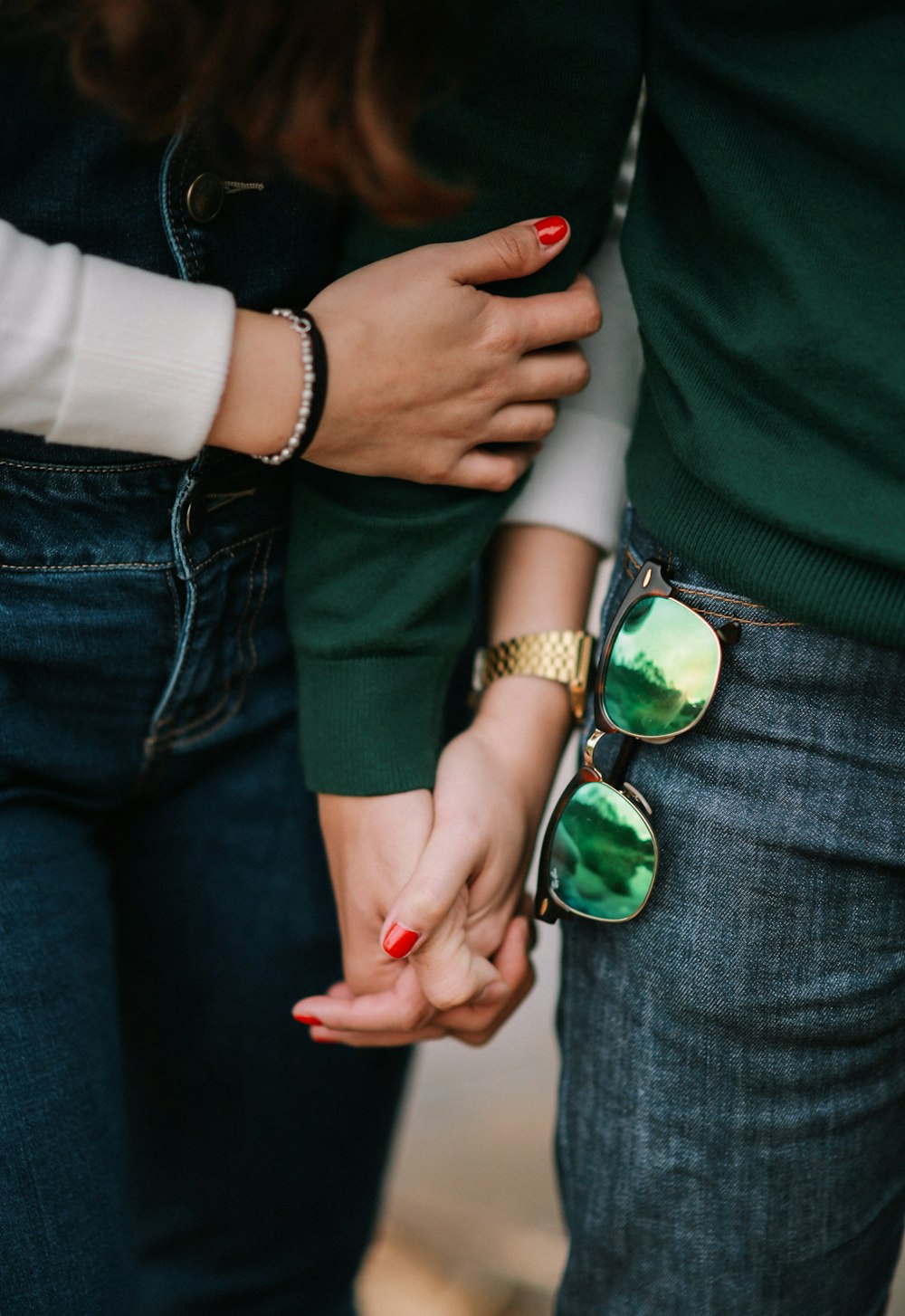 man and woman holding hands