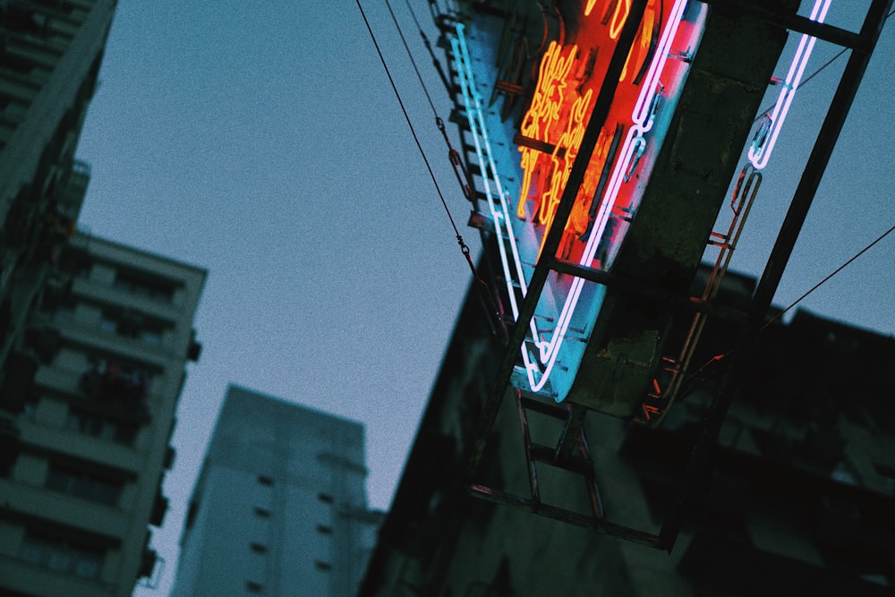 low-angle silhouette photography of lighted street signage