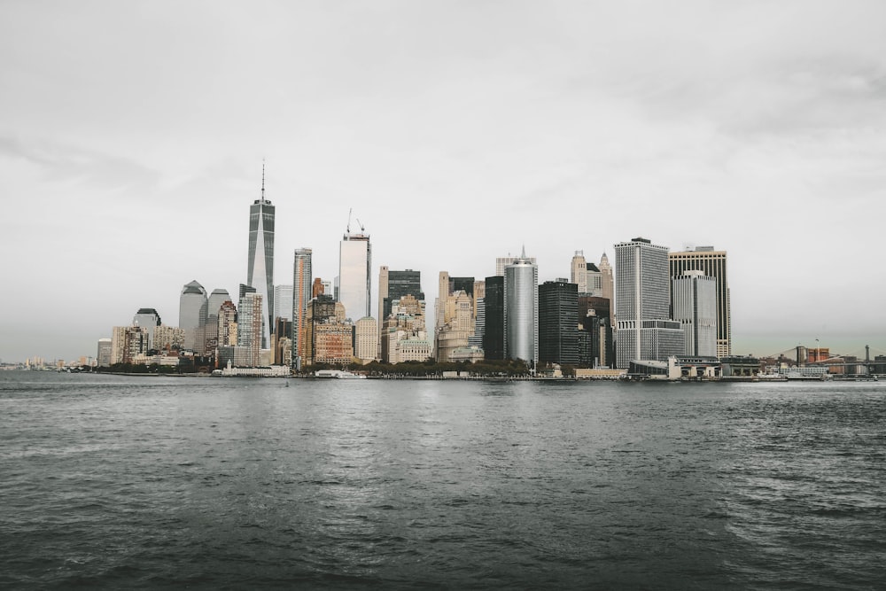 city buildings near body of water during daytime