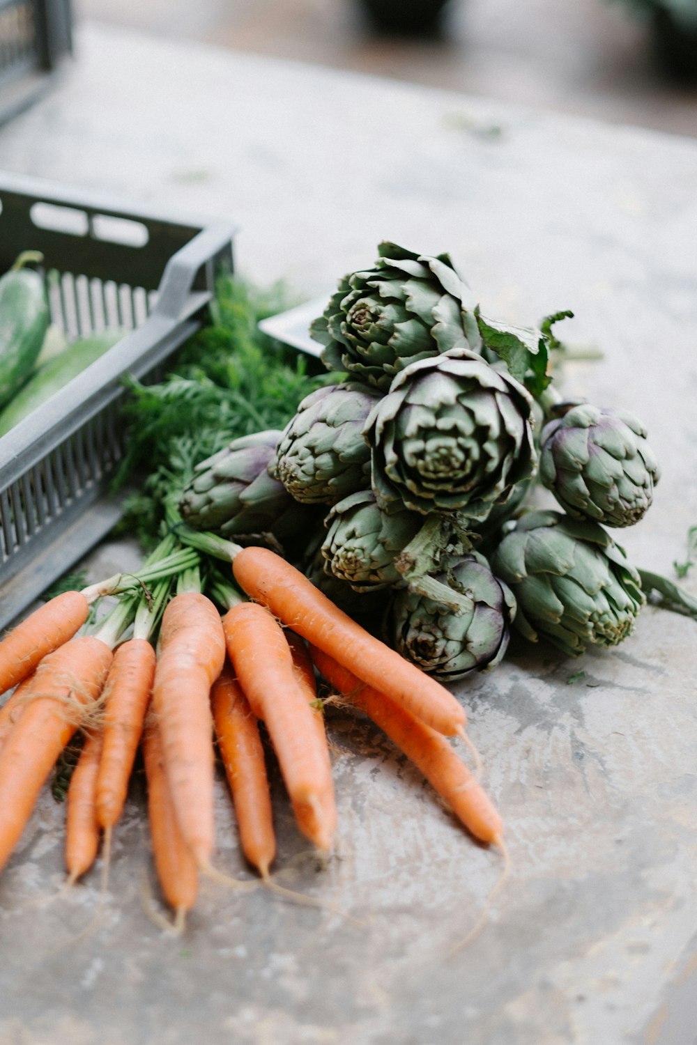 Artichoke, carrots, and fresh produce at the market ready to eat