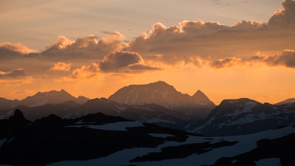 silhouette of mountain during sunset