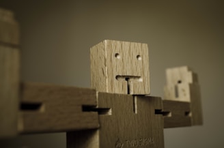 A charming cartoon figurine crafted from blocks, smiling warmly with bright, expressive eyes.