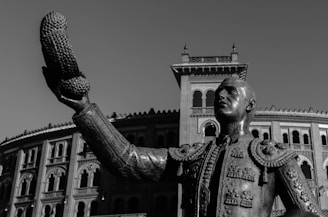 Close-up of a dwarf torero skillfully handling the cape in the arena