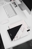 white and black notebook