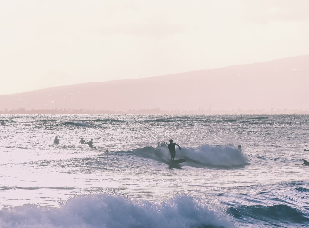 person riding surfboard