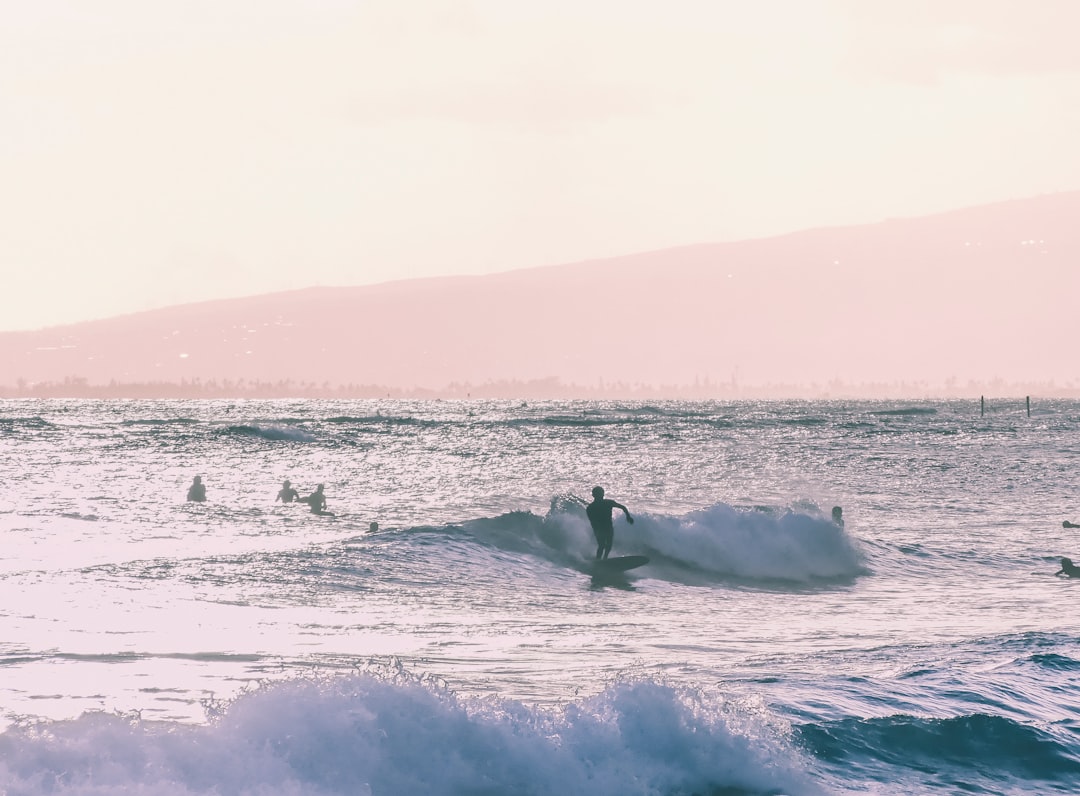 person riding surfboard