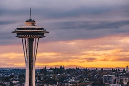 white space needle under black sky