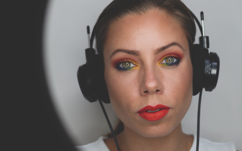 woman wearing black corded headphones