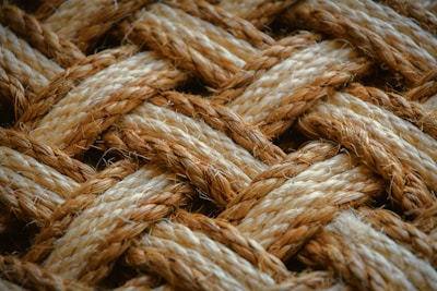Close-up of natural fibre ropes being handwoven in a Kolkata workshop.