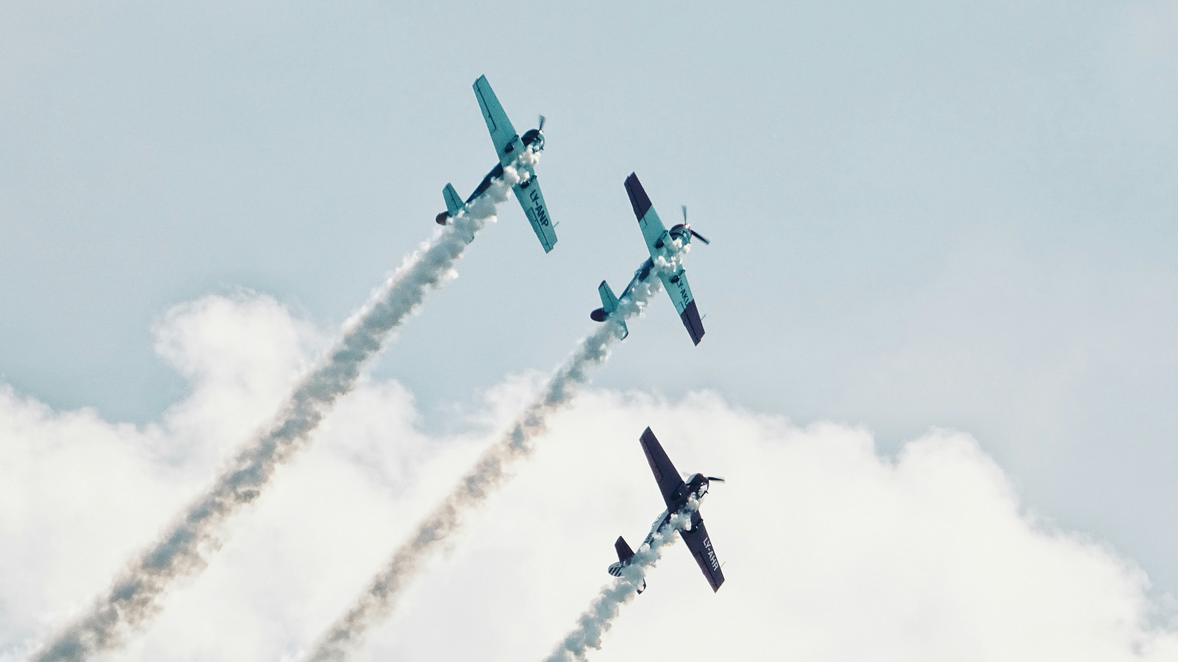 three gray plane showing smoke, Three planes at an air show