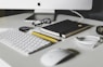 Apple Magic Keyboard and Apple Magic Mouse on white table