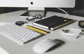 Apple Magic Keyboard and Apple Magic Mouse on white table