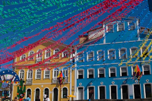 A peaceful street scene in Concepción de Buenos Aires with purple and light blue decorations celebrating local culture.