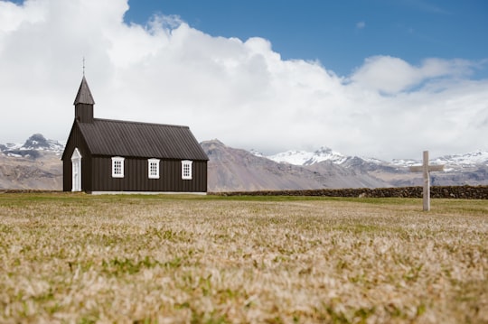 brown chapel during daytime in Búðir Iceland