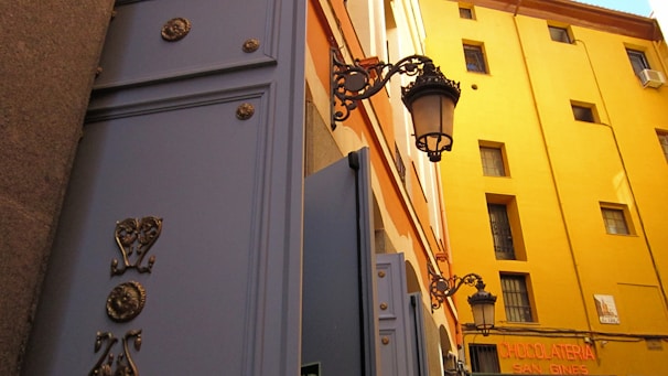 A charming street view of a local bocadillo factory with workers preparing sweets.