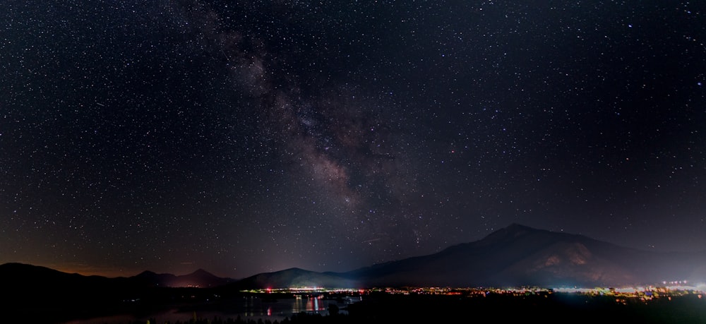 a view of the night sky with the milky in the background