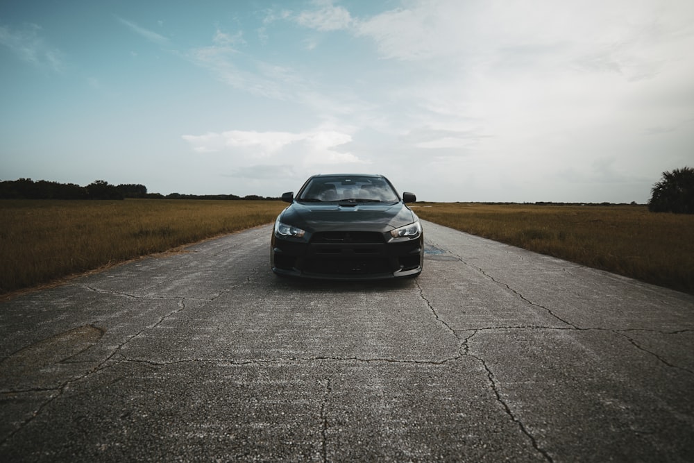 black car on concrete road