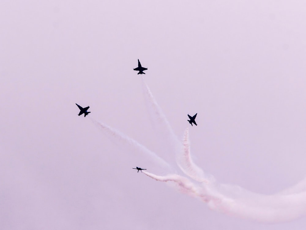 four fighter jets on sky