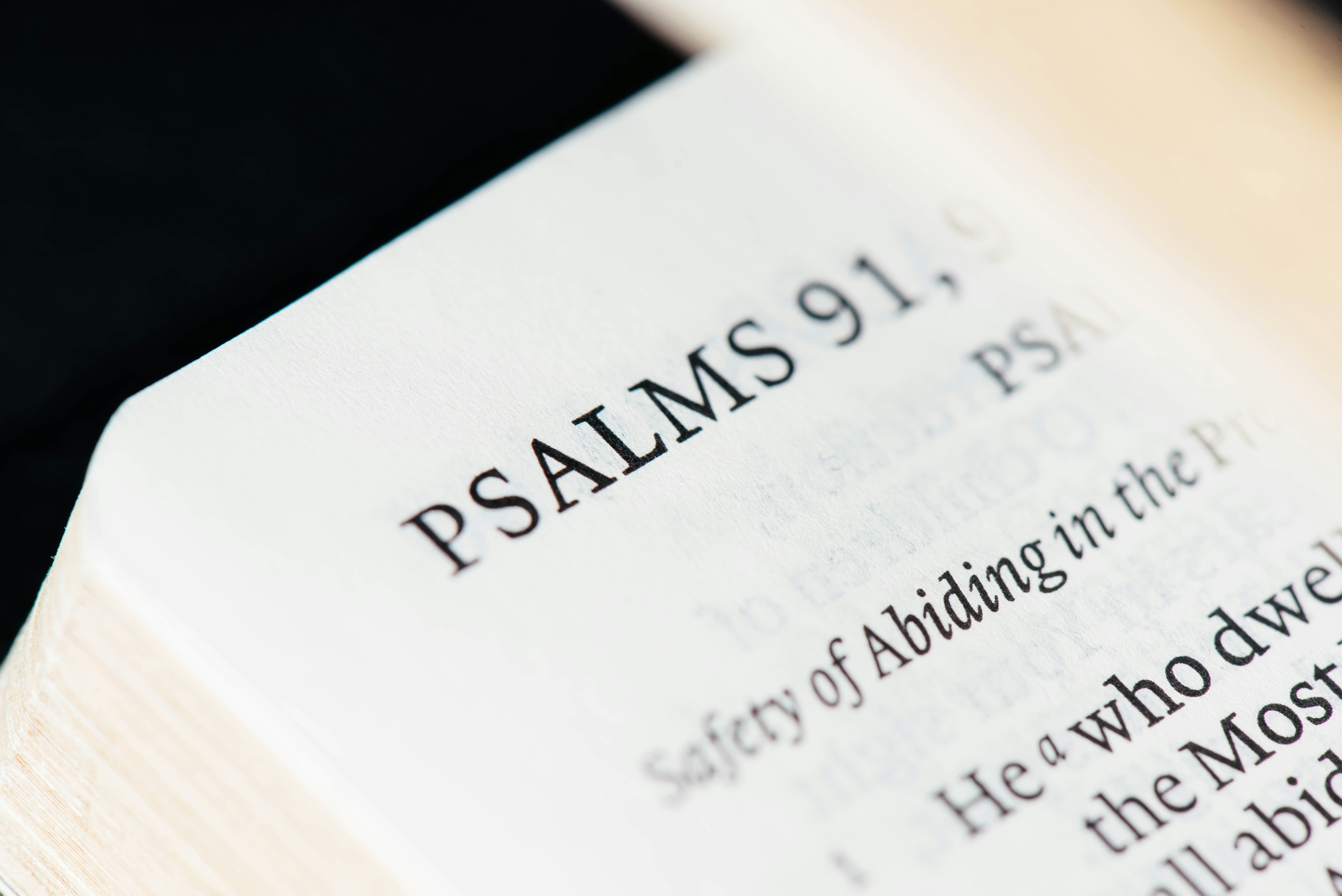 A macro shot of Psalms 91, a religious text.