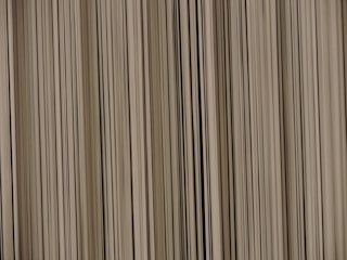 A pattern of vertical lines with varying thickness and shades, creating a barcode-like appearance.