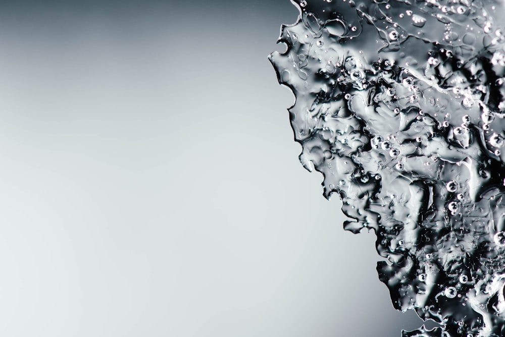 a close up of water droplets on a surface