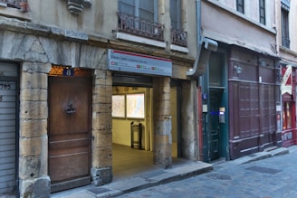 A guide pointing out architectural details on a stroll through Lyon's Renaissance district