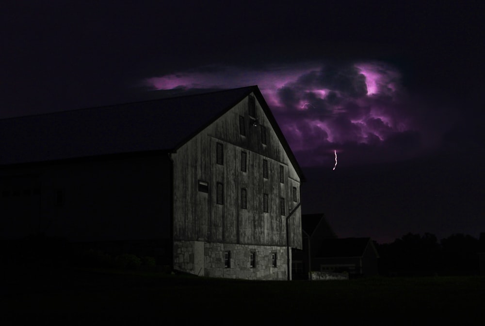 gray barn taken at nighttime