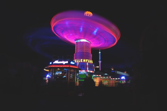 lighted amusement park during night in Theresienwiese Germany