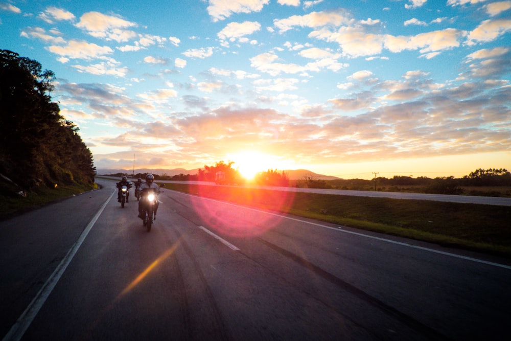 timelapse photo of busy road during golden hour