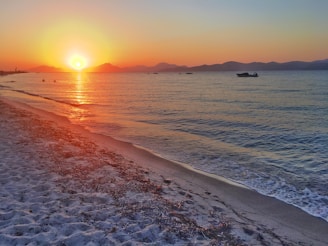 View of the nearby beach along the Bay of Bengal at sunset.