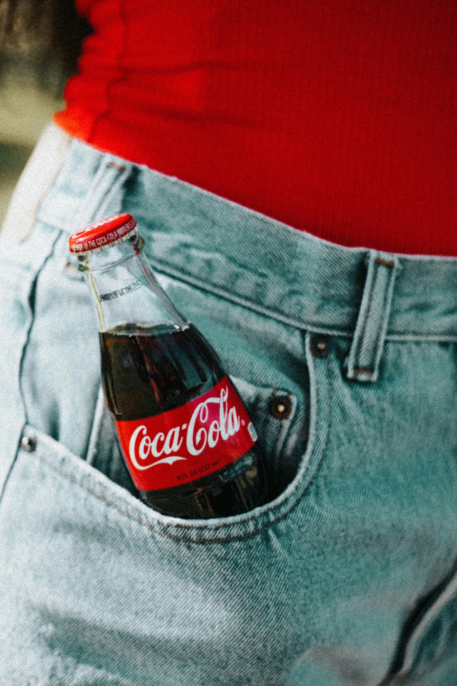 Coca-Cola glass bottle on pocket