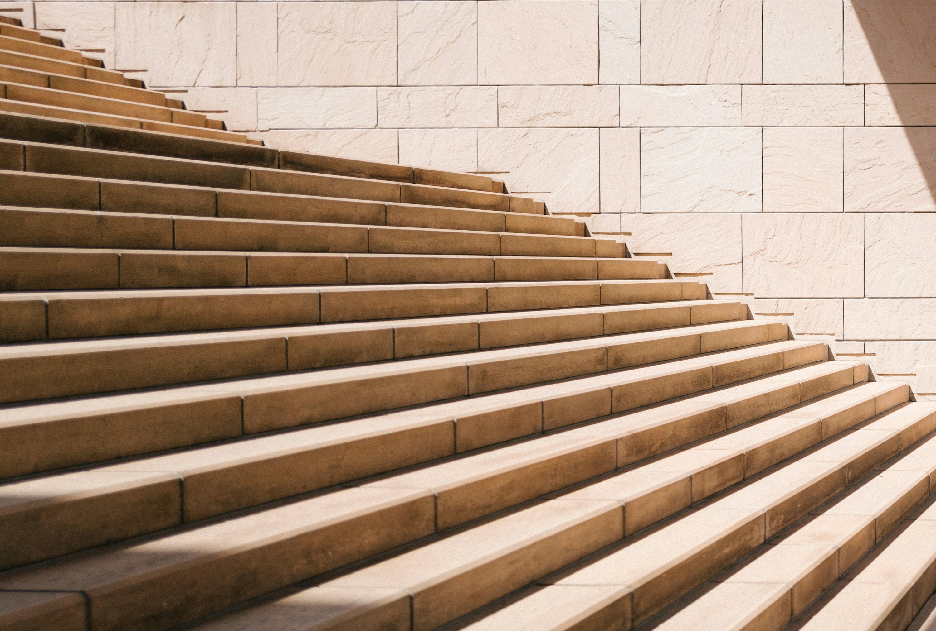 toddler's standing in front of beige concrete stair