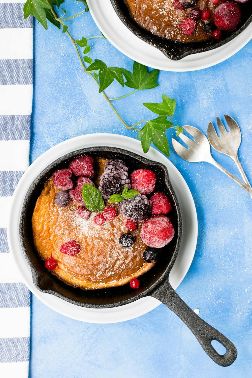 cooked pancake with raspberries and blueberries